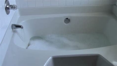 bathtub filling with water and stock footage video 100 royalty free 3168058 shutterstock