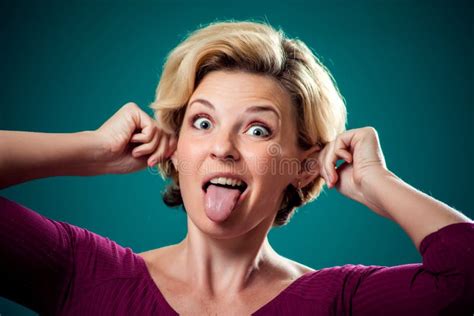 Funny Looking Woman Making Funny Face Showing Tongue And Ears People
