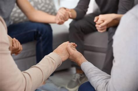 Premium Photo Young People Holding Hands During Group Therapy Closeup
