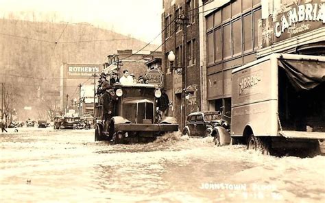 Truck Filled With People Braving The Flood Waters On Main Street By The