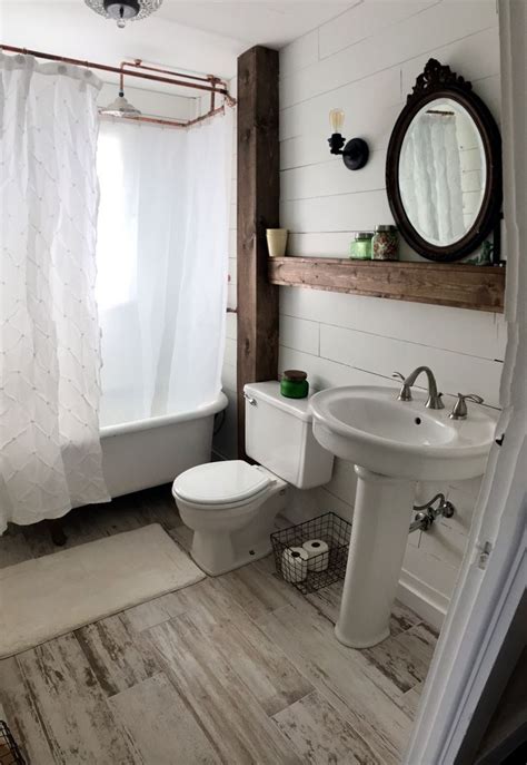 Add a feminine touch to your farmhouse half bath by hanging a ticking stripe fabric skirt below your vanity. Ideas for Vintage and Modern Farmhouse Bathroom Decor ...