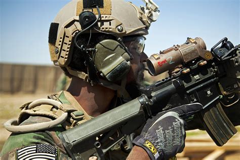 a u s marine special operations team member provides security during the construction of an
