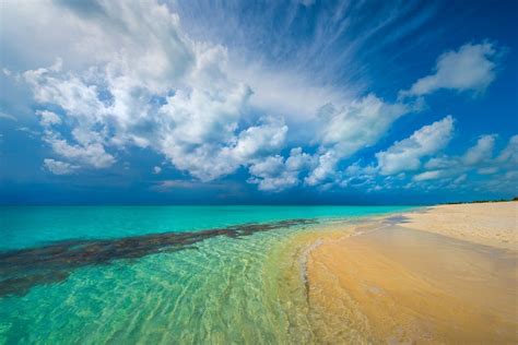 Blue Sky Over Turquoise Ocean Wallpaper And Background Image