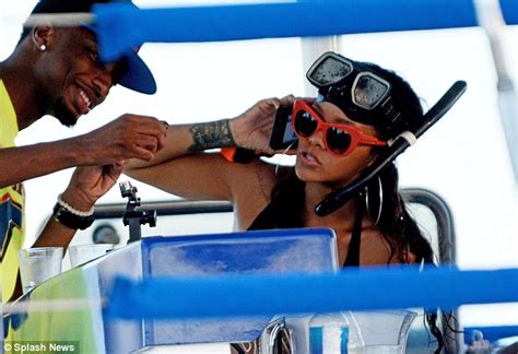 rihanna shows off her flawless figure in a halter neck bikini during a snorkelling trip with