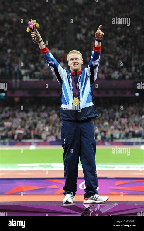 Great Britains Jonnie Peacock Celebrates With His Gold Medal In The