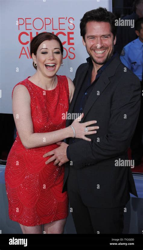 Actress Alyson Hannigan And Alexis Denisof Arrive For The 38th Annual