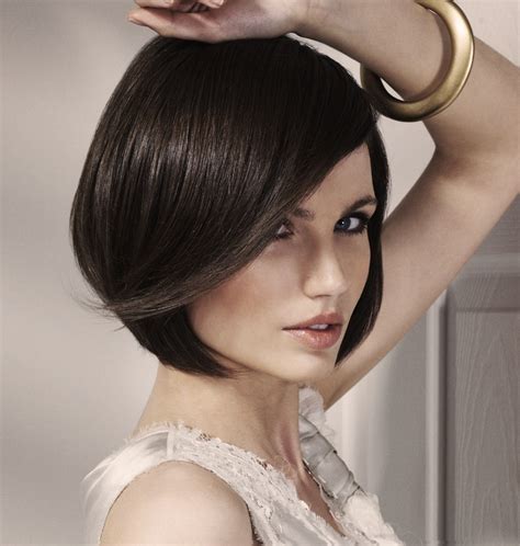 This is a bob look cut pretty bluntly staying true to trend just below the chin. Smooth bob with a touch of flapper and length just below ...