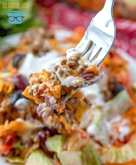 To make this delicious dorito casserole simply brown the beef and onion, add the taco seasoning, tomatoes, chilies, mushroom soup, and sour cream. Dorito Taco Casserole - The Country Cook main dishes