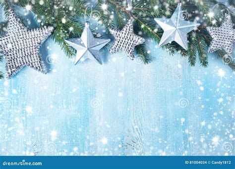 Christmas Stars On Wooden Background With Fir Tree Branches Stock Photo