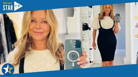 Carol Vorderman Slips Her Enviable Curves Into A Black Pinafore