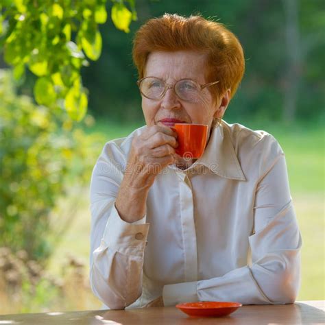Smiling Woman In Glasses Is Drinking Coffee Outdoors Stock Image Image Of Face Mature 98943345