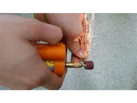 A Person Is Holding An Orange Object In Their Left Hand With Sparks