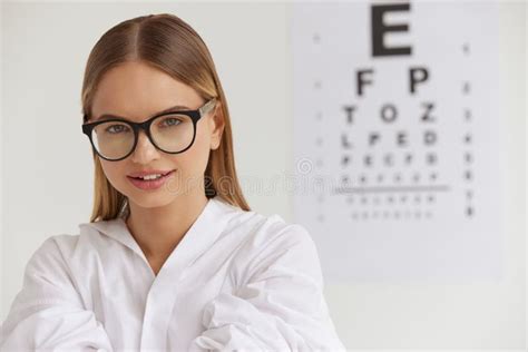 Optometry And Vision Smiling Girl At Ophthalmologist Office Stock