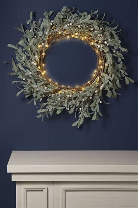 This Cheerfully Rustic Wreath Features Leafy Branches Dotted With