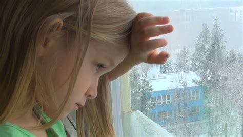 Unhappy Crying Sad Caucasian Child Looking Out Window