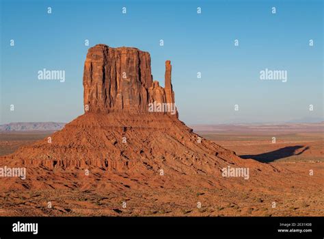 The Famous West Mitten Rock Formation At Sunset In Monument Valley