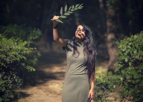 Photo Of Woman Holding Leaf · Free Stock Photo