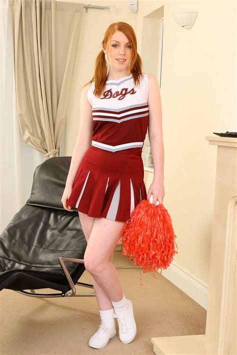 Cheerleader With Pigtails Wearing Socks Sneakers And Mini Dress