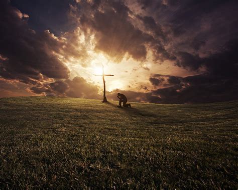 A Man Kneeling At A Cross At Sunset Royalty Free Stock Image Storyblocks