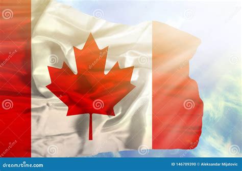 Canada Waving Flag Against Blue Sky With Sunrays Stock Photo Image Of