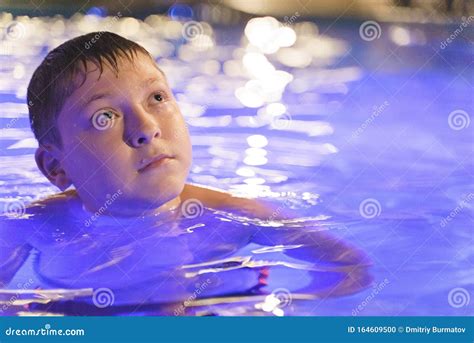 Boy In A Night Swimming Pool With Illumination Stock Photo Image Of
