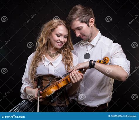 Loving Young Couple With Violin Stock Photo Image Of Corset