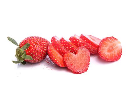 Slices Of Strawberries With A Single Strawberry Stock Photo Image Of