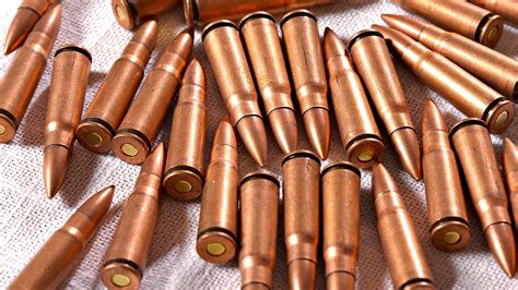Brass Colored Gun Bullet Lot Ammunition Weapon Hd Wallpaper
