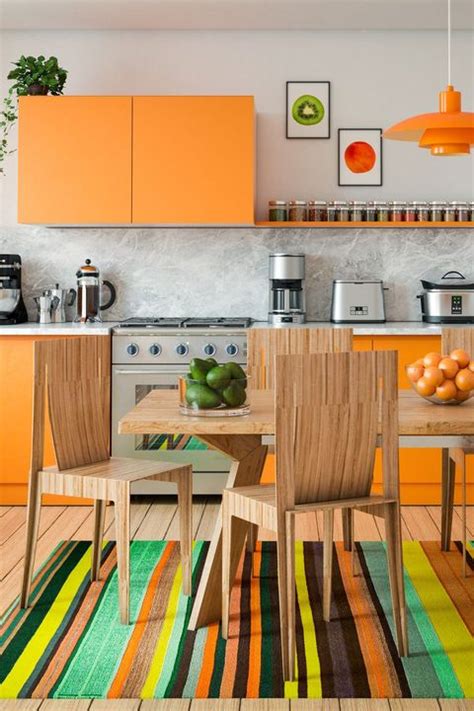 Instead, the cabinets, shelving, and some of the furniture share the same orange hue. 7 Must-See Orange Kitchens - How to Use Orange Cabinets & Decor in Kitchens