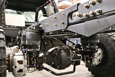 The levels sensors are mounted on a bracket near the upper control arms on the front of the the air strut is an assembly consisting of a monotube shock absorber with electromagnetic. Riding on Air: A Primer on Kelderman Suspension Systems ...