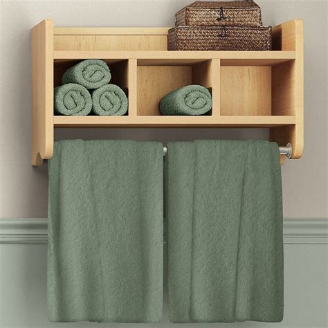 Two Towels Are Hanging On A Shelf Above The Towel Rack And In Front Of