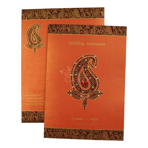 Card Is Made From An Orange Metallic Board With Top And Bottom Gold