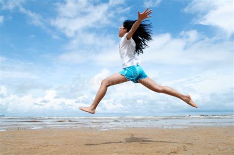 Excited Young Girl Leaping In The Air Stock Photo Image Of Enjoyment