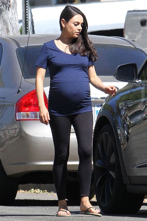 Mila Kunis Bares Her Bump In A Tight Tee And Leggings