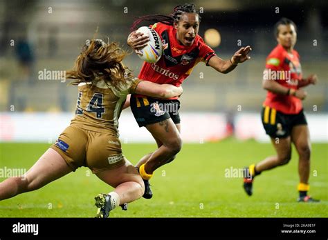 Papua New Guineas Lisa Marie Alu Is Tackled By Canadas Maddy Aberg