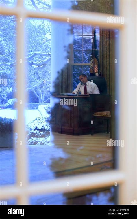 President Barack Obama Talks On The Phone In The Oval Office 12709