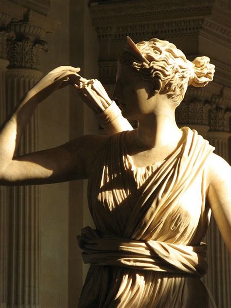 Eternal Statue of the Greek goddess Artemis Latin Diana with a deer detail Musée du