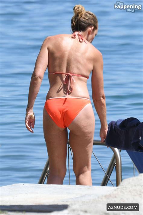 toni collette rocks an orange bikini for a sexy seaside getaway in ischia aznude