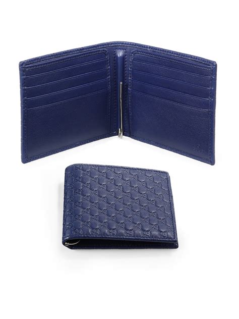 Introducing the gucci wallets for men, the signature web stripe motif can be found on key favorites as well as gucci's gg pattern embossed on its smooth and tumbled leather wallets. Gucci Microsima Leather Money Clip Wallet in Blue for Men ...