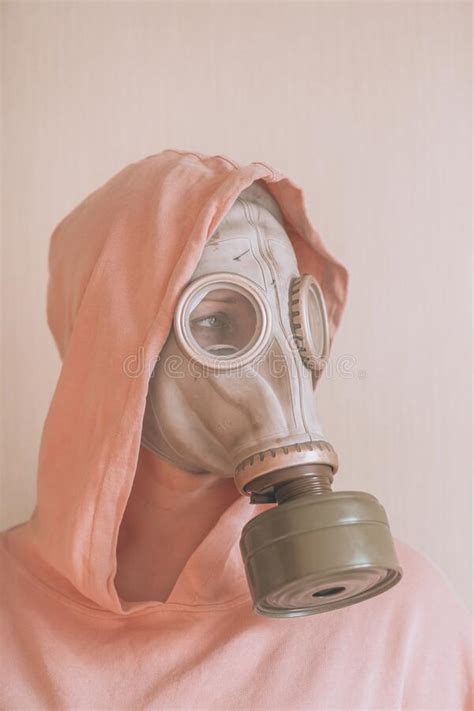 Woman In Pink Gas Mask And Respirator Holding A Bottle Living Water In