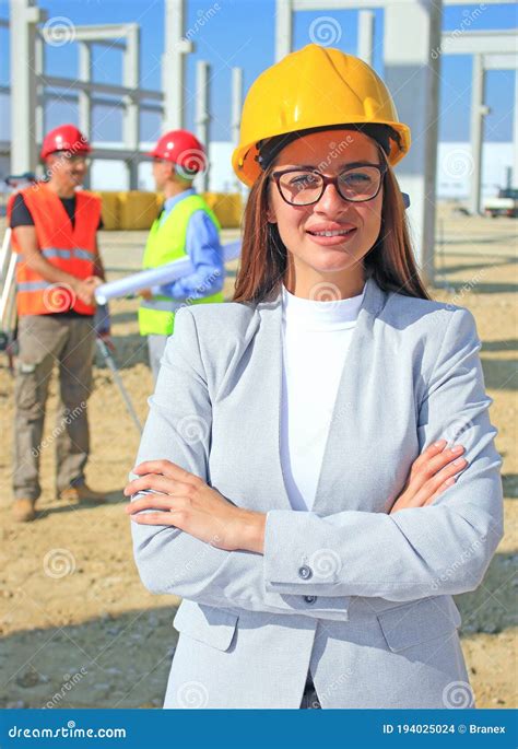 Happy Beautiful Female Architect On A Construction Site Stock Photo