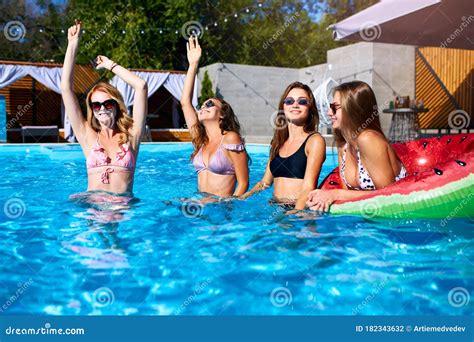 Girls In Bikini Drinking Cocktails And Gossip Outdoors Royalty Free Stock Photography