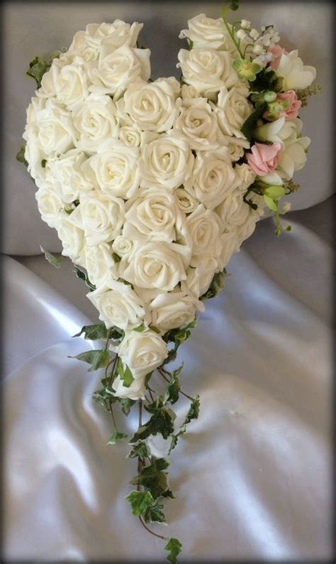 Ivory Heart Shaped Bouquet With A Soft Pink And Green Spray And