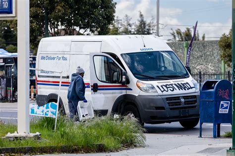 Why are postal delivery workers being robbed in Oakland?