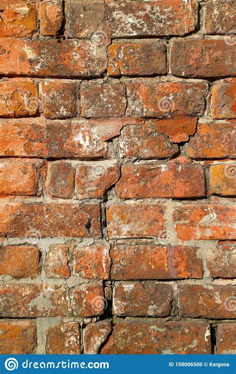 Texture Of An Old Damaged Brick Wall With A Big Crack In It Stock Photo Image Of City Aged
