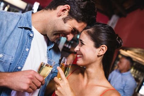 Premium Photo Couple Enjoying Champagne In Nightclub