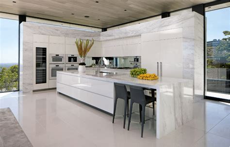 Stainless steel, concrete, marble and wood can all be layered together. modern marble l-shaped luxury kitchen with long island ...