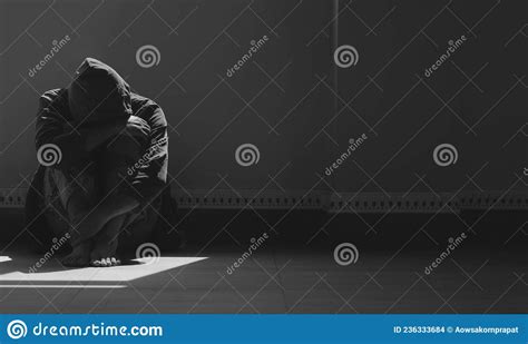Sunlight And Shadow On Surface Of Hopeless Man Sitting Alone With