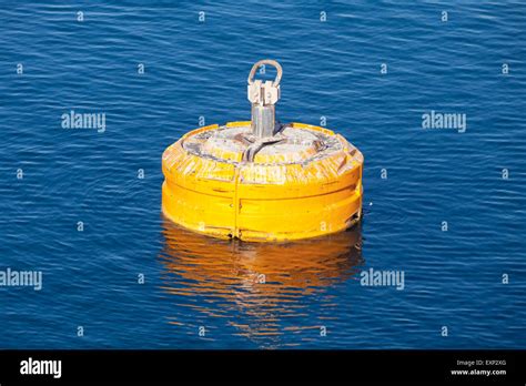 Yellow Mooring Buoy Floating On Blue Sea Water Stock Photo Alamy