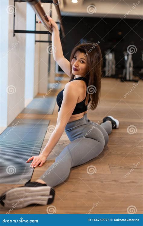 Young Woman Doing Stretching Exercises In Gym Stock Image Image Of Beauty Adult 144769975